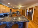 Kitchen with Stainless Appliances, Granite Counter Tops and  Bar Seating for 2